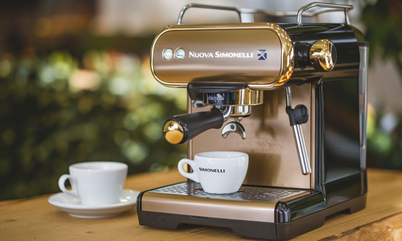 A sleek Nuova Simonelli espresso machine brewing a rich espresso shot in a café setting.